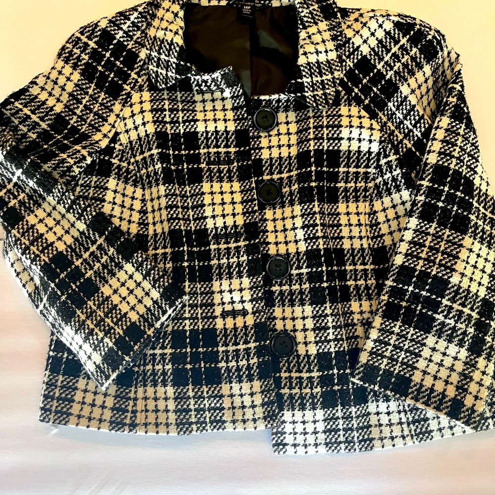 Plaid black and white jacket looks great over anything to dress you up